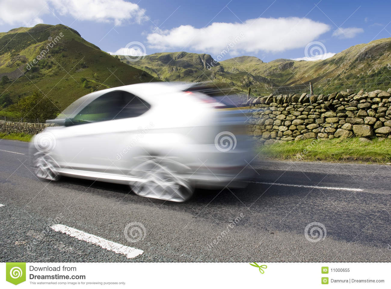 blurred-car-mountain-road-uk-11000655.jpg