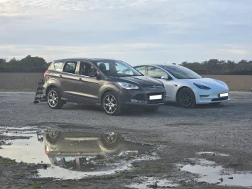 Kuga and Tesla.webp