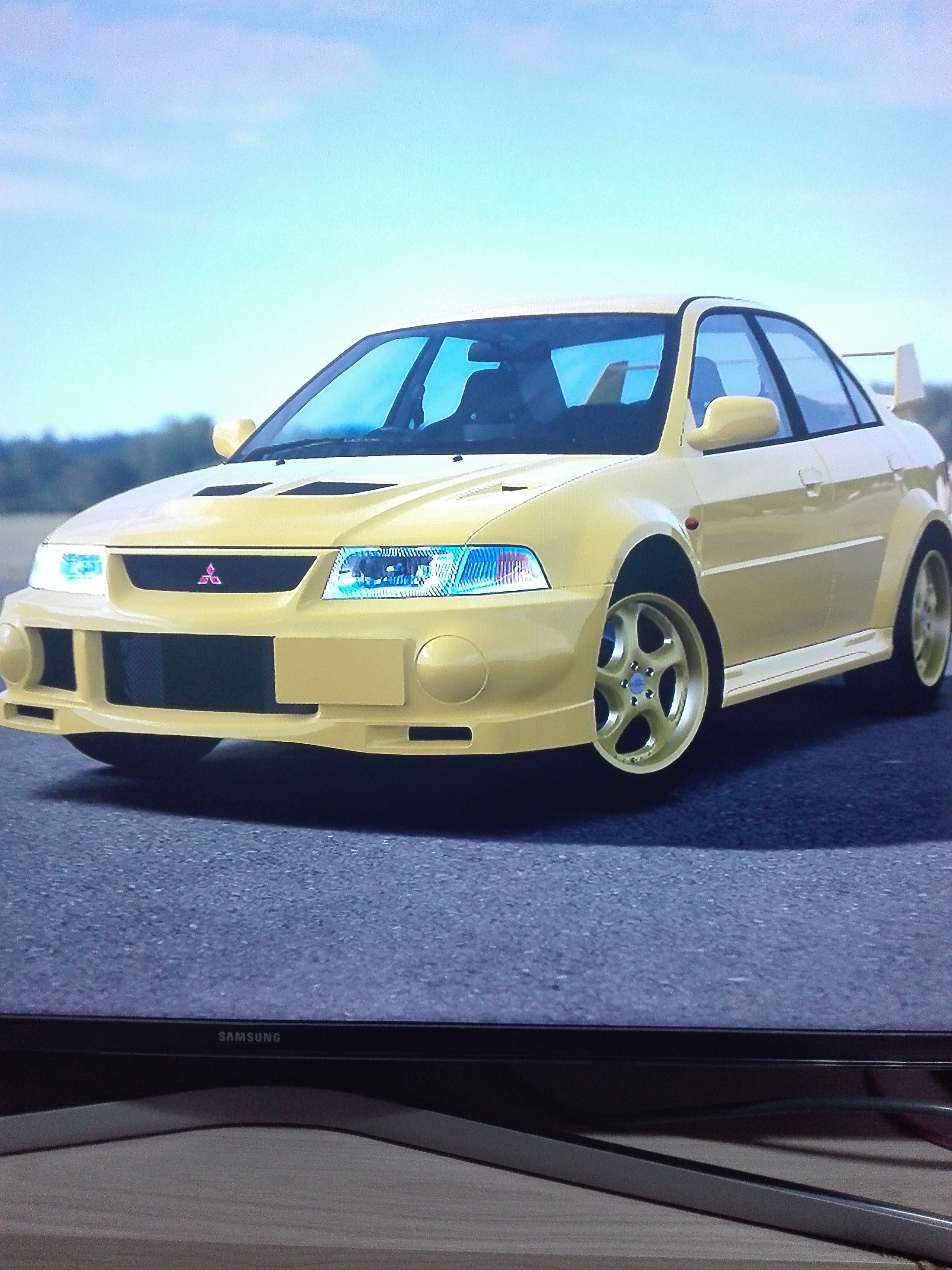 Mitsubishi Lancer Evolution IV GSR yellow