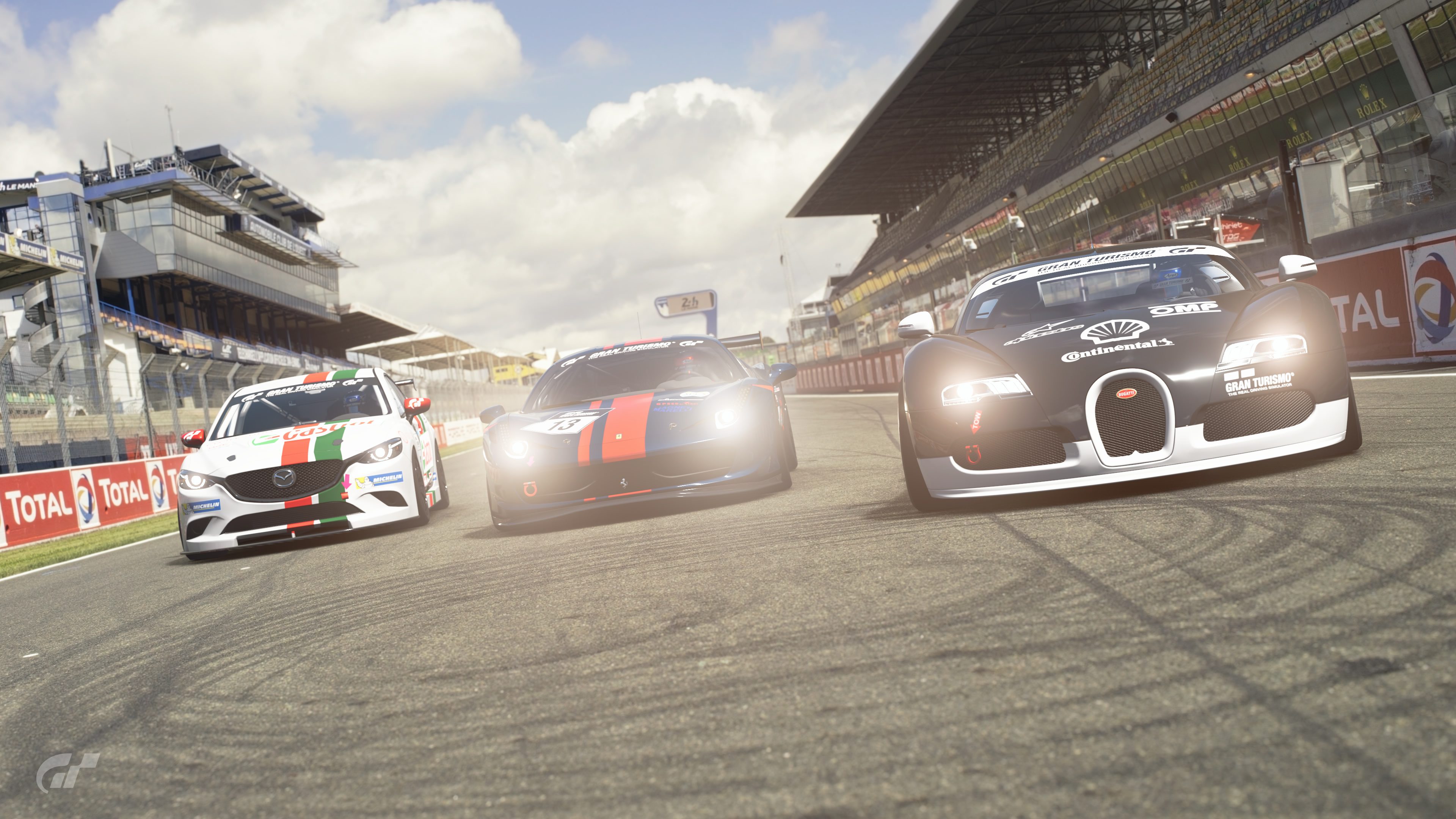 Some Group 4 cars taking a glance on the Circuit de la Sarthe straight