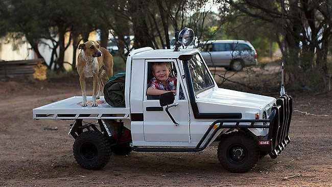 849885-boy-with-mini-land-cruiser.jpg