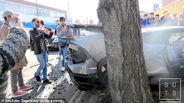 11433210-6847797-The_bonnet_of_the_car_was_crushed_by_the_wall_and_the_rear_smash-a-2_1553591435378.jpg