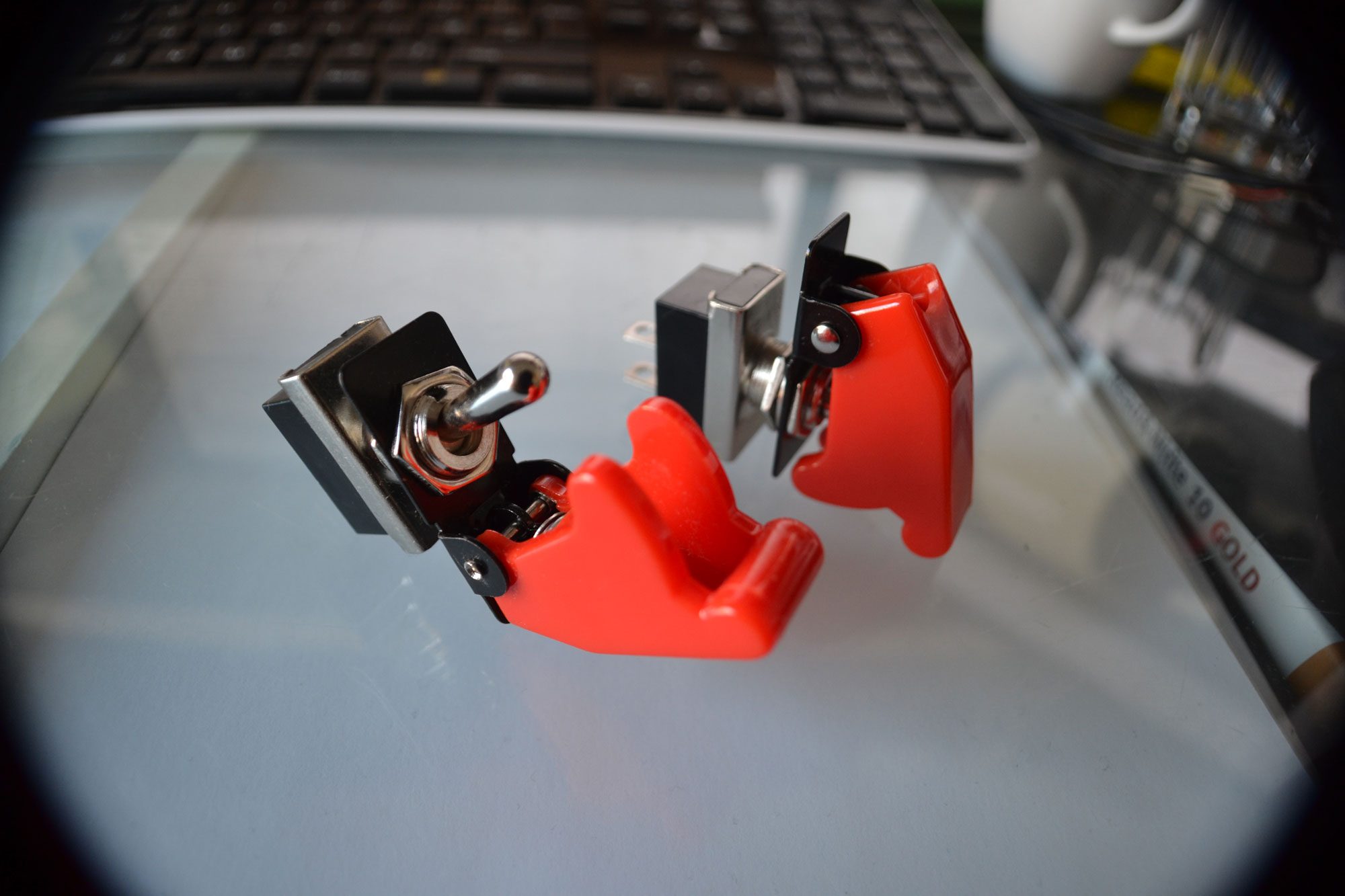red-covered-toggle-switches.jpg