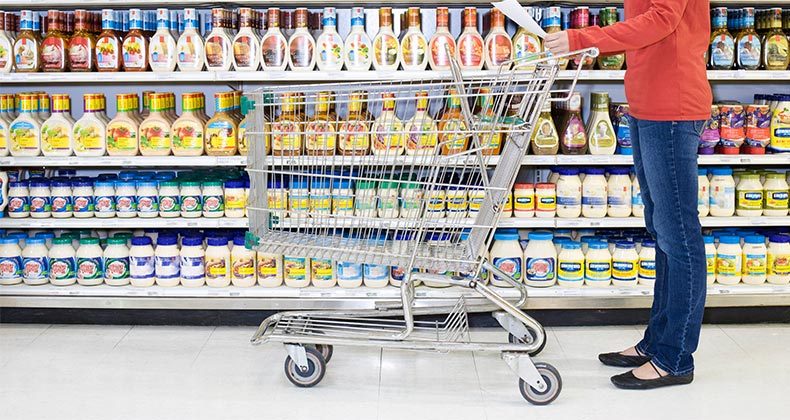 woman-shopping-grocery-cart-mayo-aisle-getty-mst.jpg
