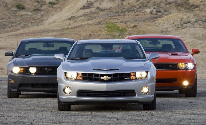 2010-ford-mustang-gt-coupe-2010-chevrolet-camaro-ss-and-2009-dodge-challenger-r-t-photo-277950-s-1280x782-876x535.jpg