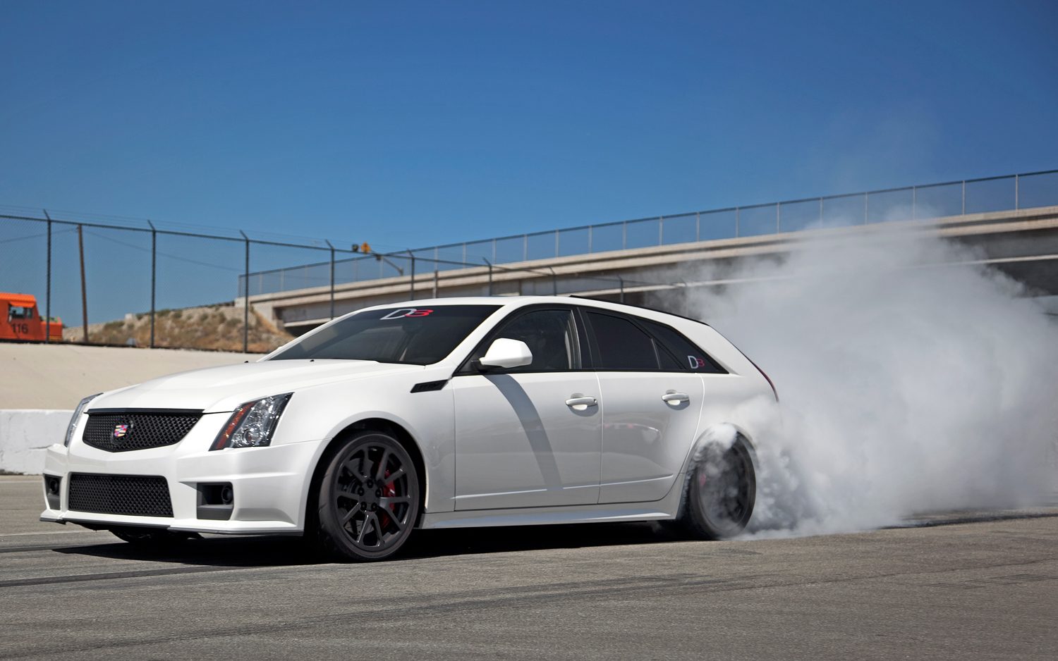 d3-cadillac-cts-v-wagon-front-three-quarter-burn-out.jpg