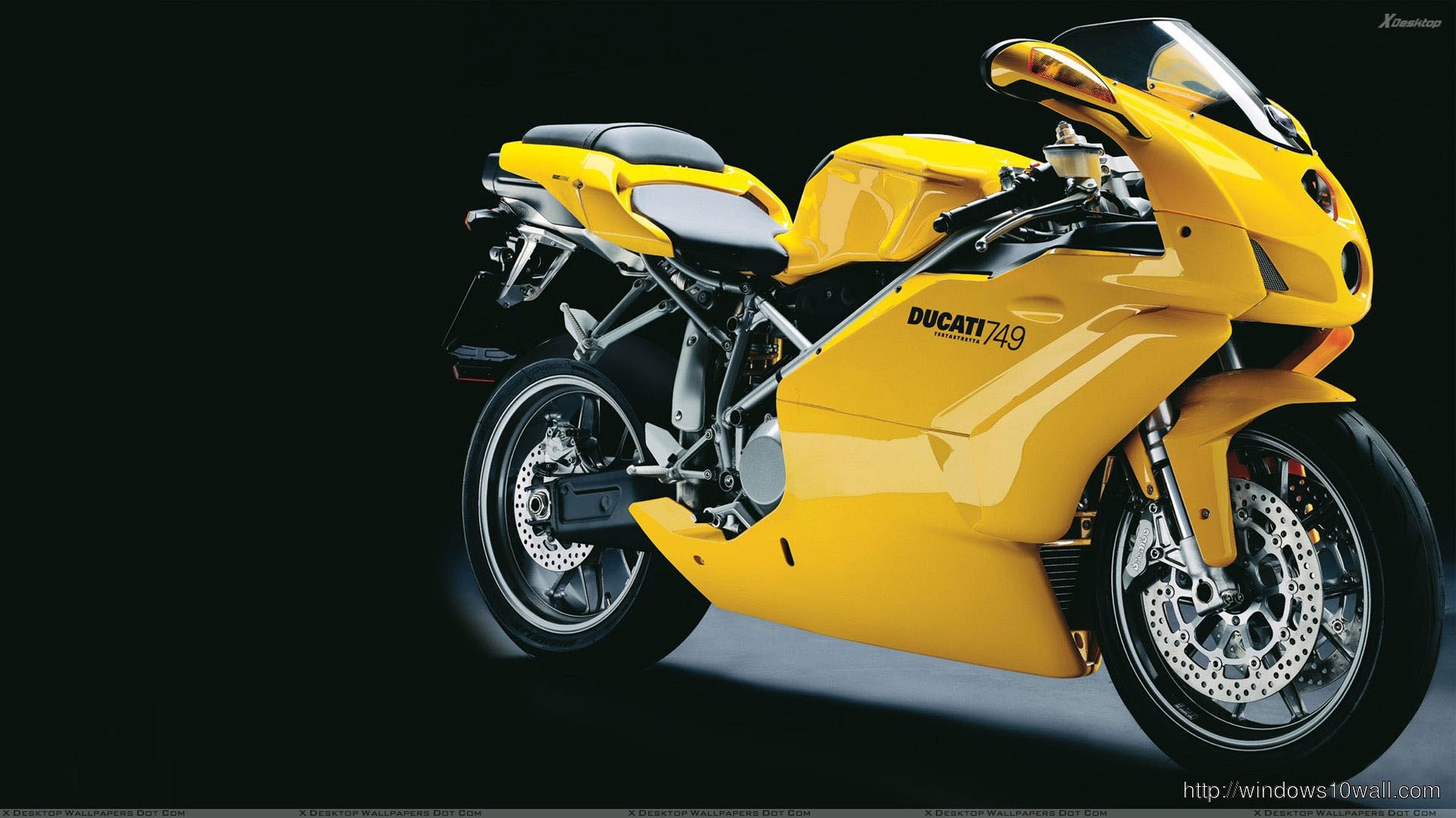 Ducati-749-2005-in-Yellow-Side-Pose-And-Black-Background-HD-Wallpaper.jpg