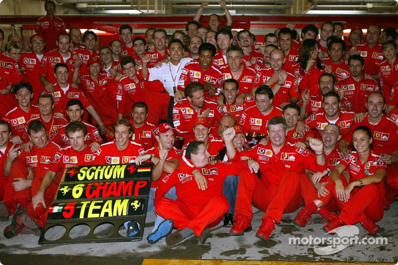 f1-japanese-gp-2003-michael-schumacher-and-rubens-barrichello-celebrate-with-ferrari-team.jpg