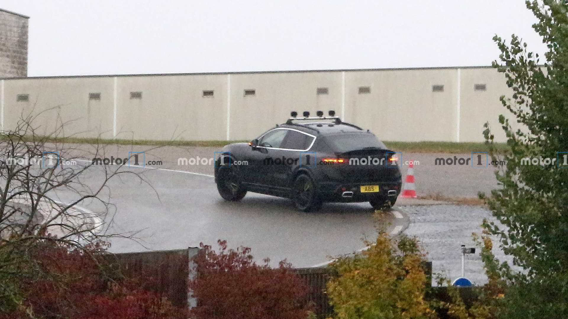 2022-porsche-macan-electric-first-spy-photo-rear-three-quarters.jpg