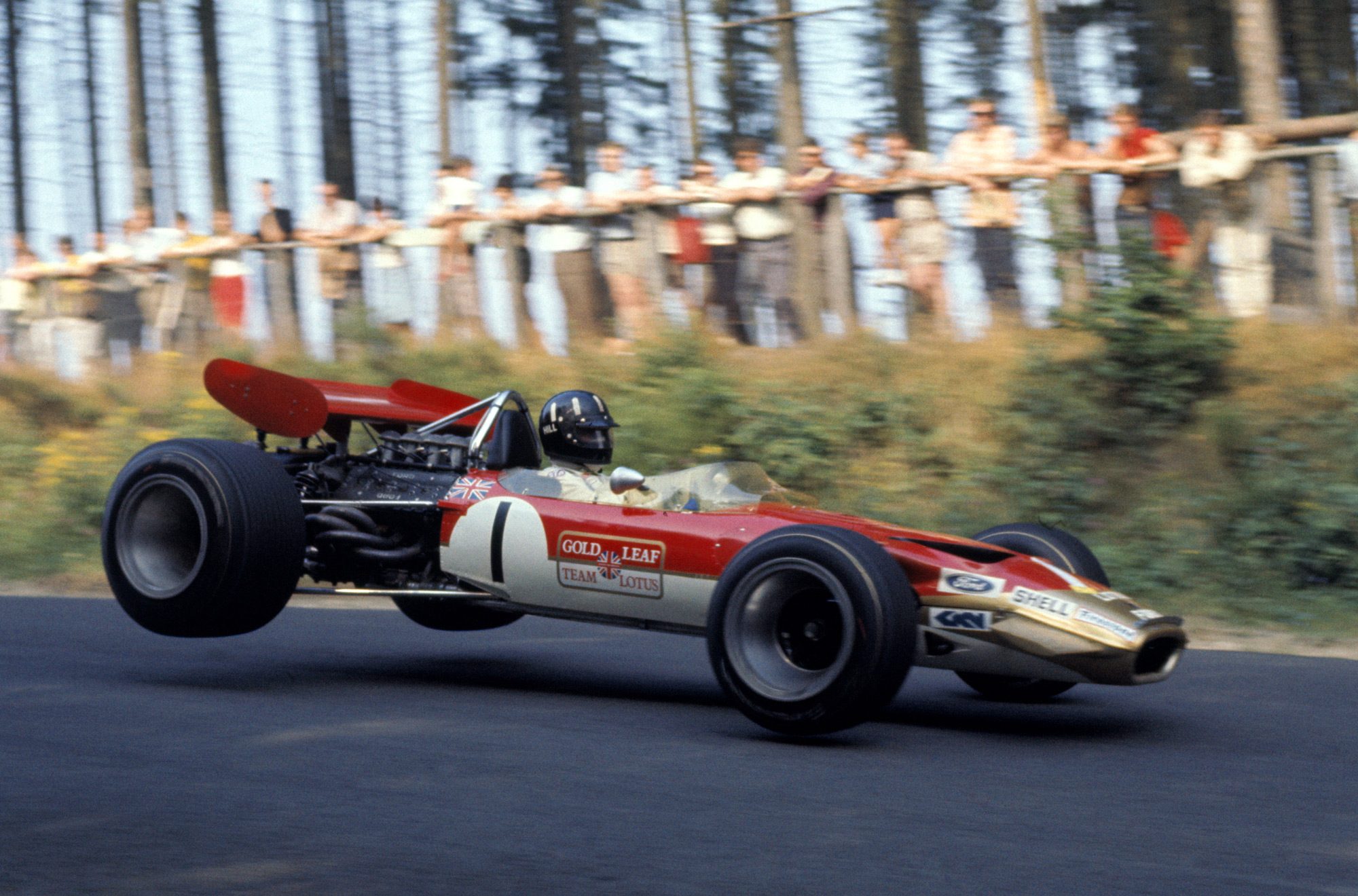 1 гоночные автомобили. Лотус ф1. Болид ф1 Лотус. Lotus Formula 1 1969. Lotus 49b Грэм Хилл 1968.