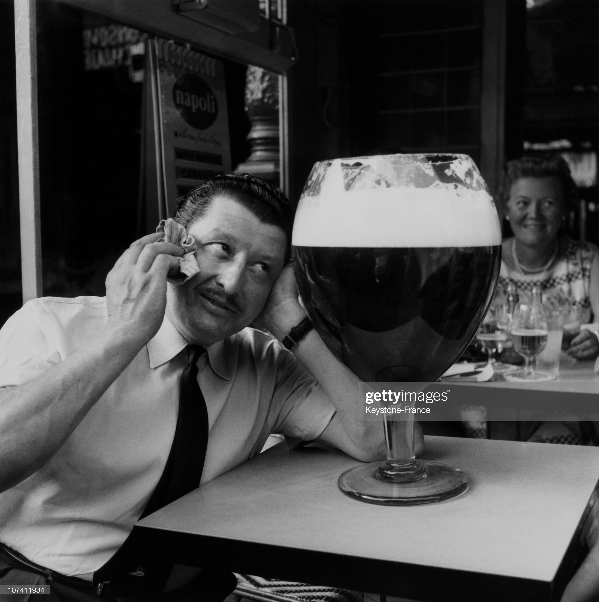 parisian-next-to-a-huge-glass-with-beer-in-the-fifties.jpg