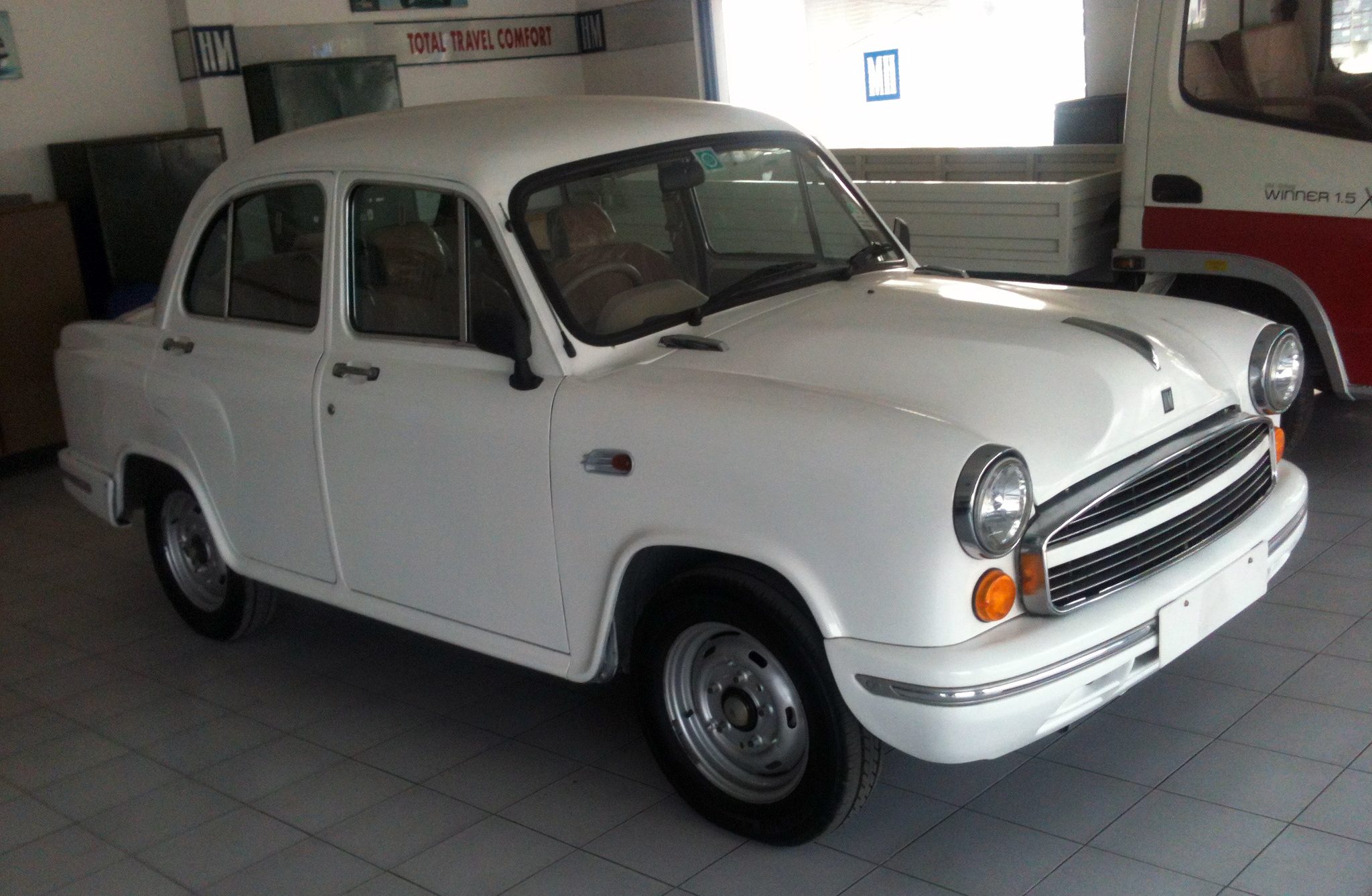 2013_Hindustan_Ambassador_Grand_in_showroom%2C_front_right.jpg